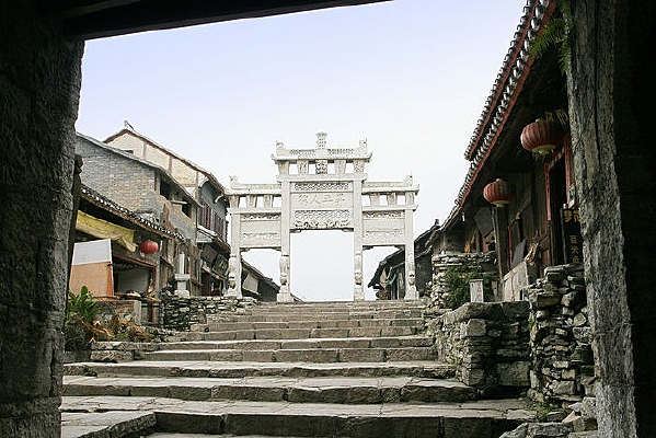 Stone archway and lantern-lit lanes of Qingyan Ancient Town