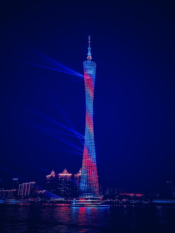Canton Tower, the twisted Xiaomanyao tower lit up over the Pearl River at night, Guangzhou
