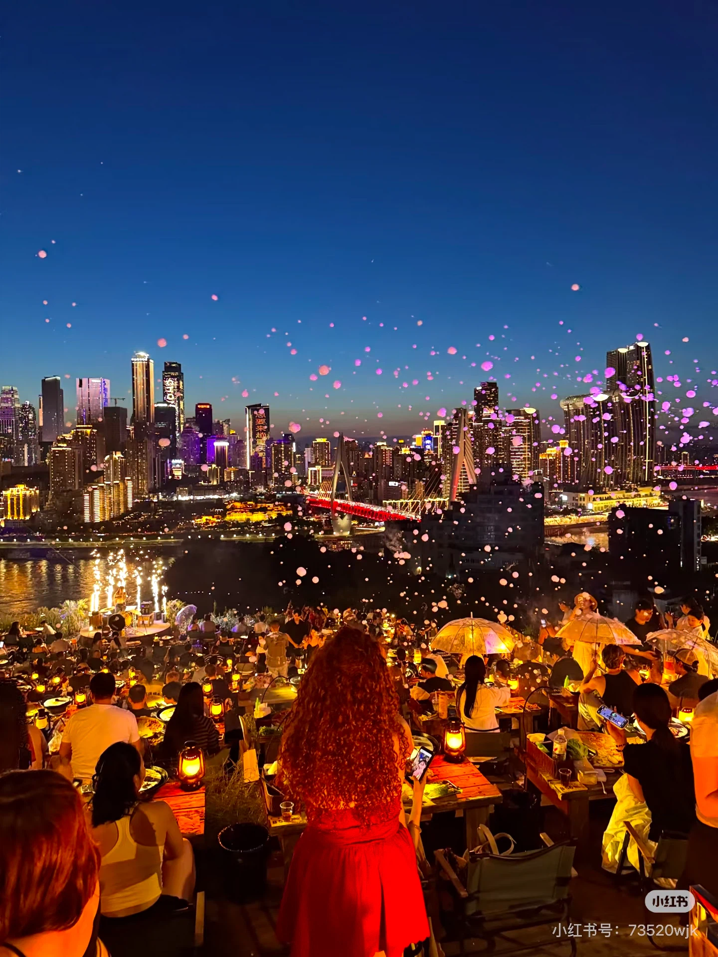 Riverside rooftop dining at night in Chongqing