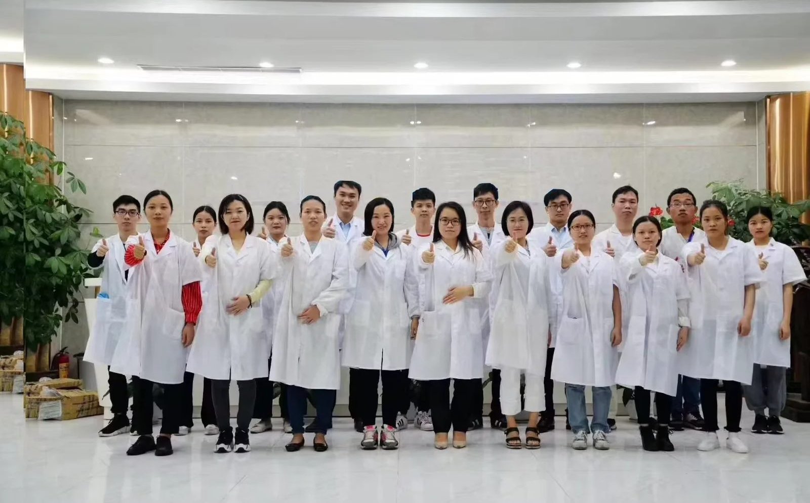 FANH production and quality team wearing white lab coats