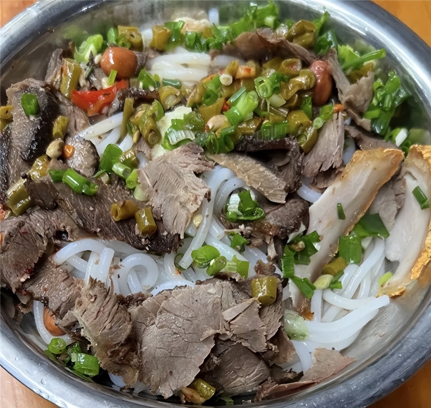 A bowl of Guilin rice noodles with braised toppings