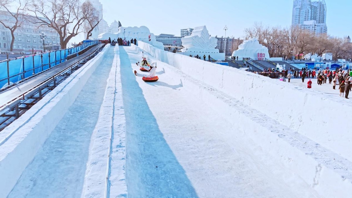Snow slide and ice activities on the frozen Songhua River in Harbin