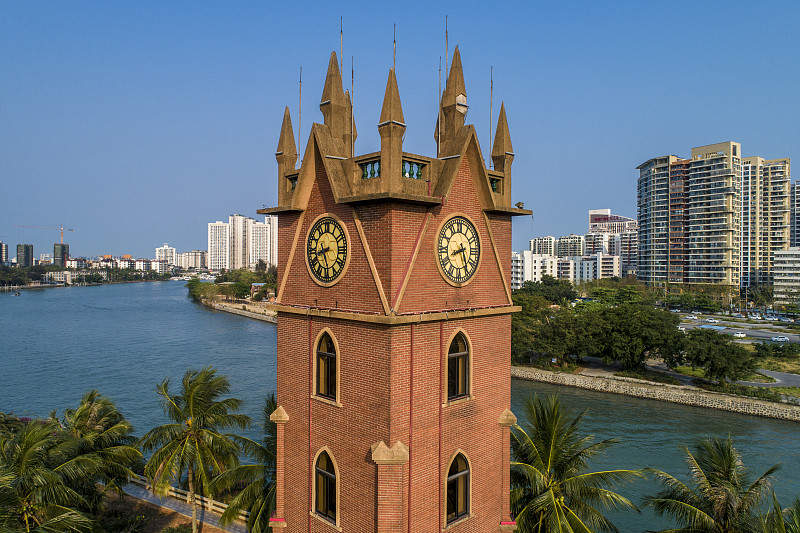 The red-brick Haikou Clock Tower by the water