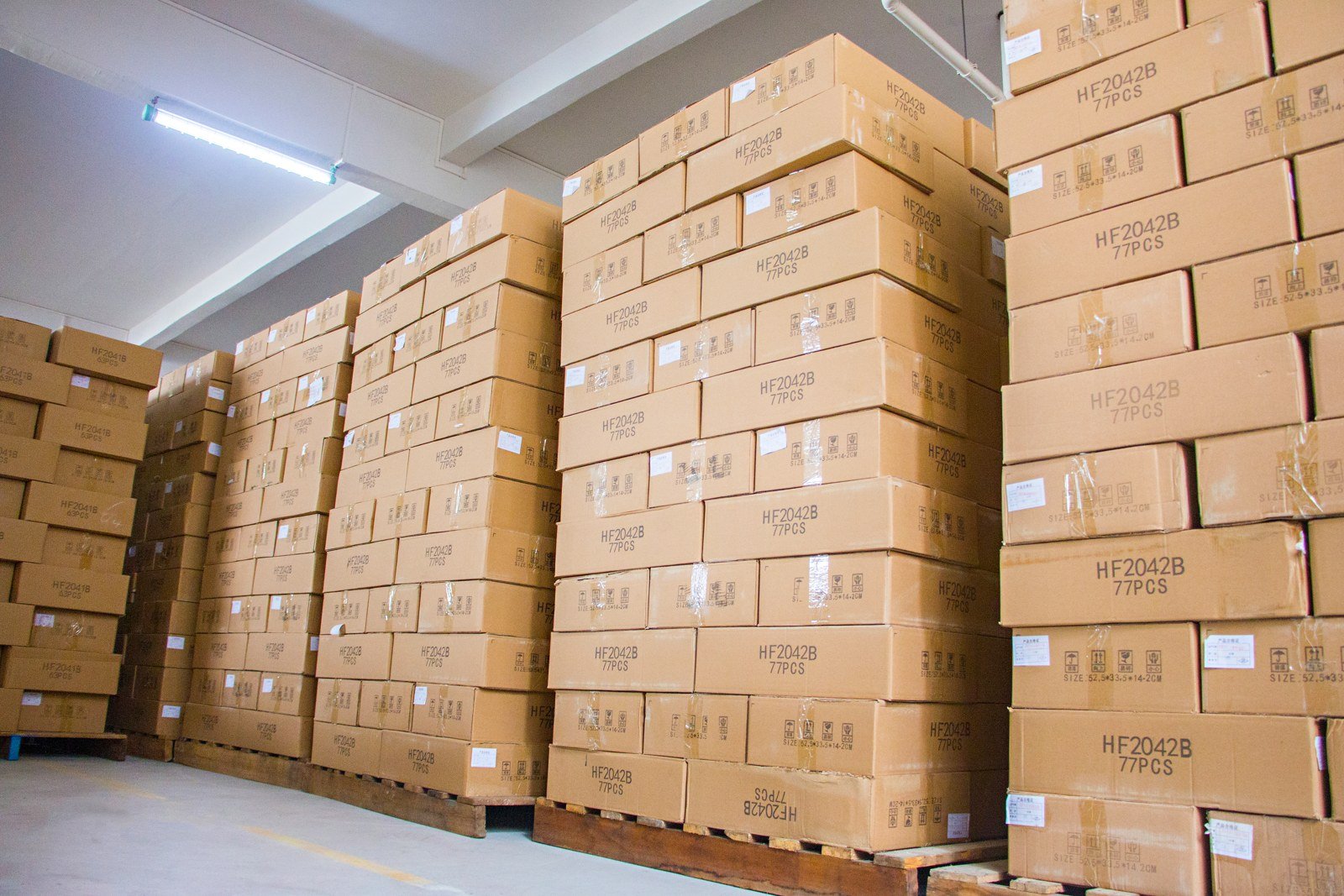 Pallets of finished-goods cartons stacked in bulk before dispatch