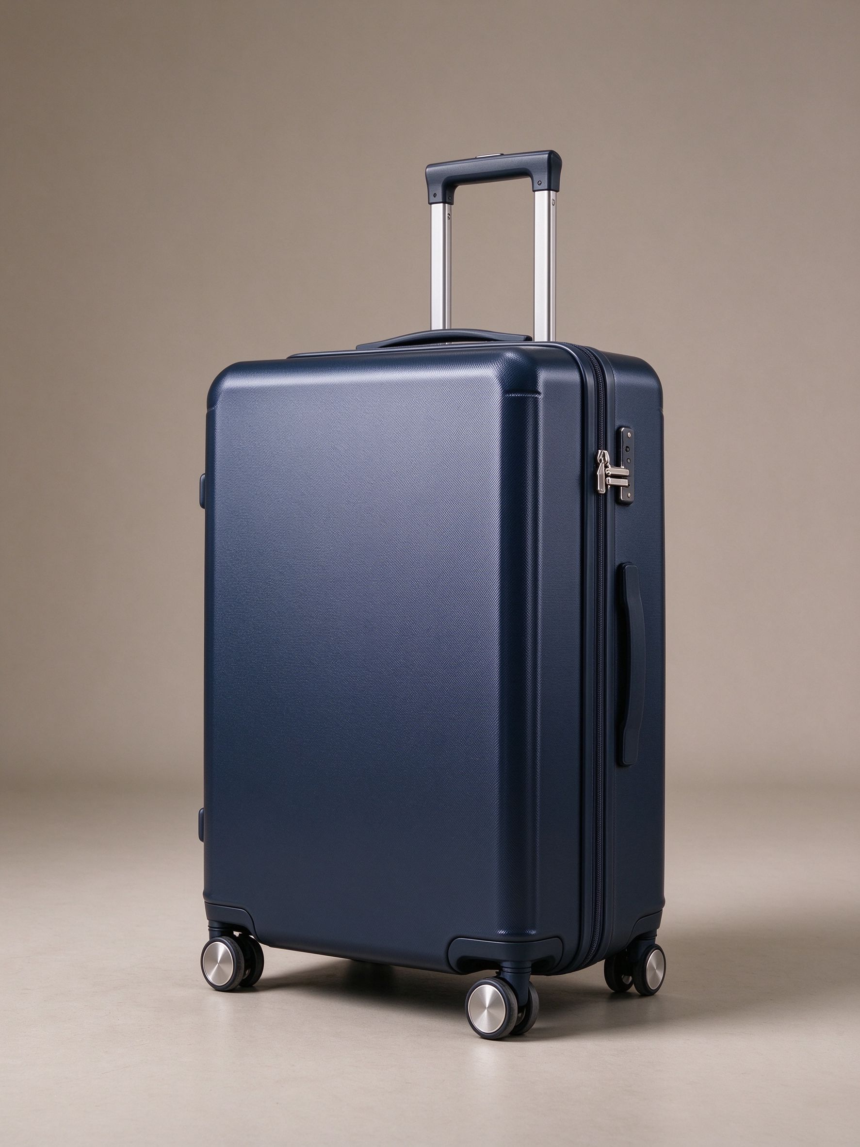 Navy hard-shell suitcase with spinner wheels and telescopic handle