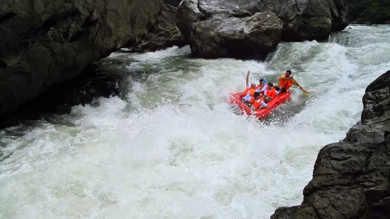 Red rafts running the rapids of Shui Chun River canyon, Libo