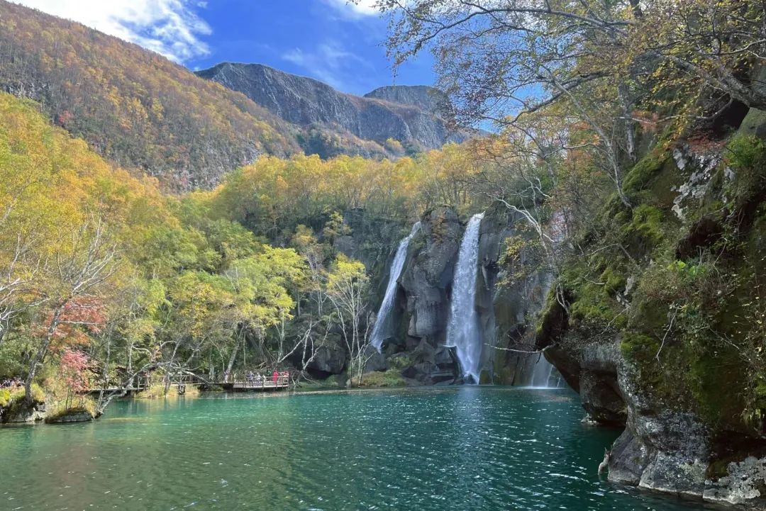 Lvyuan Pool deep green water with twin waterfalls, Changbaishan