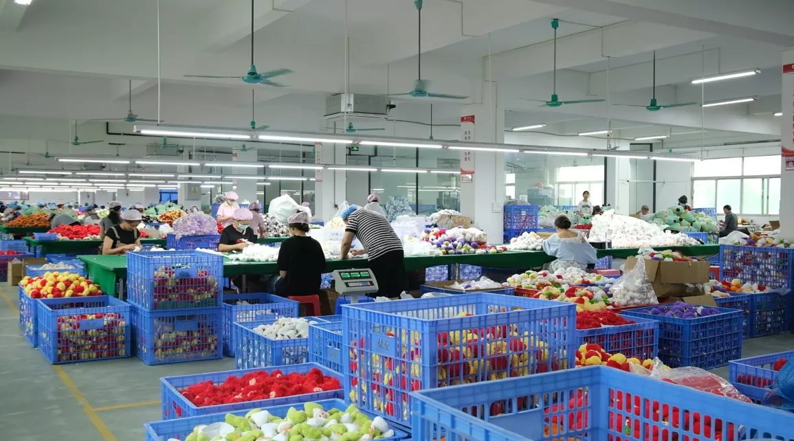 Plush toy production floor with finished parts organised in crates