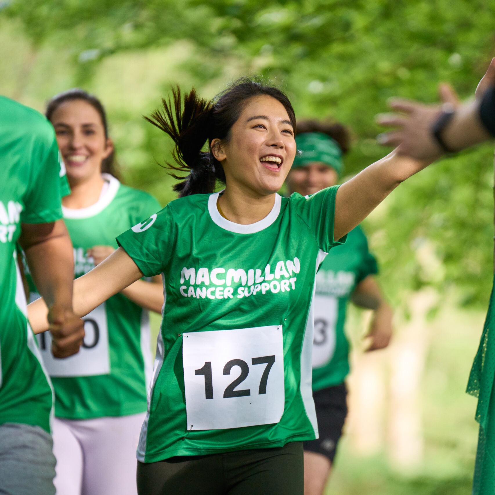 Marathon runners in branded event t-shirts
