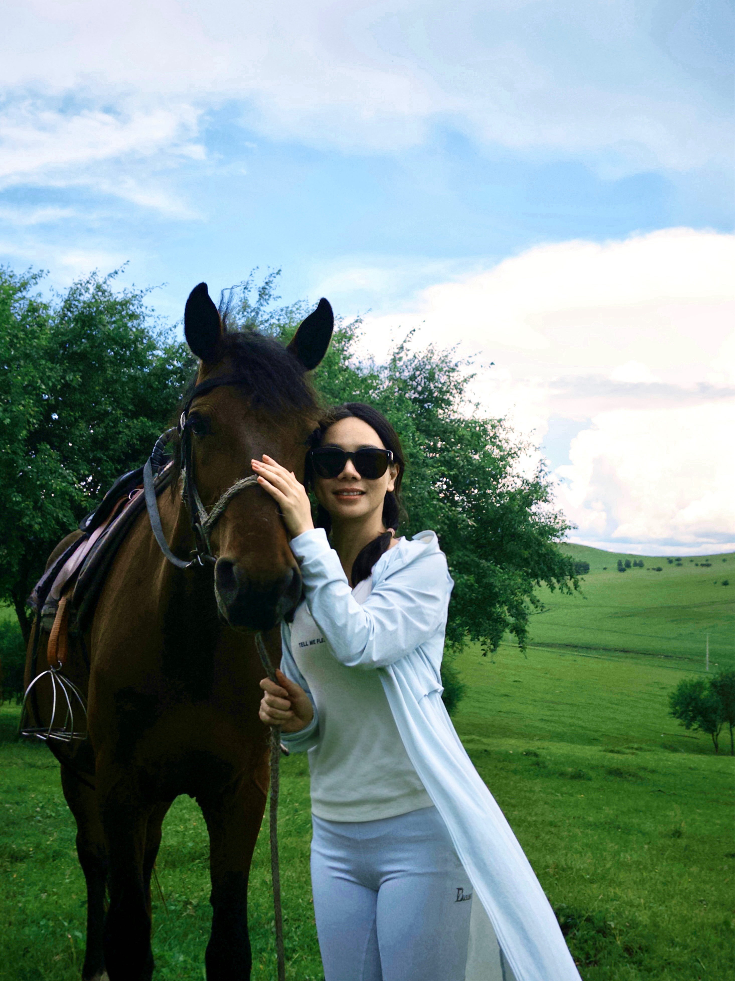 Lumi with her horse — she lives what she designs