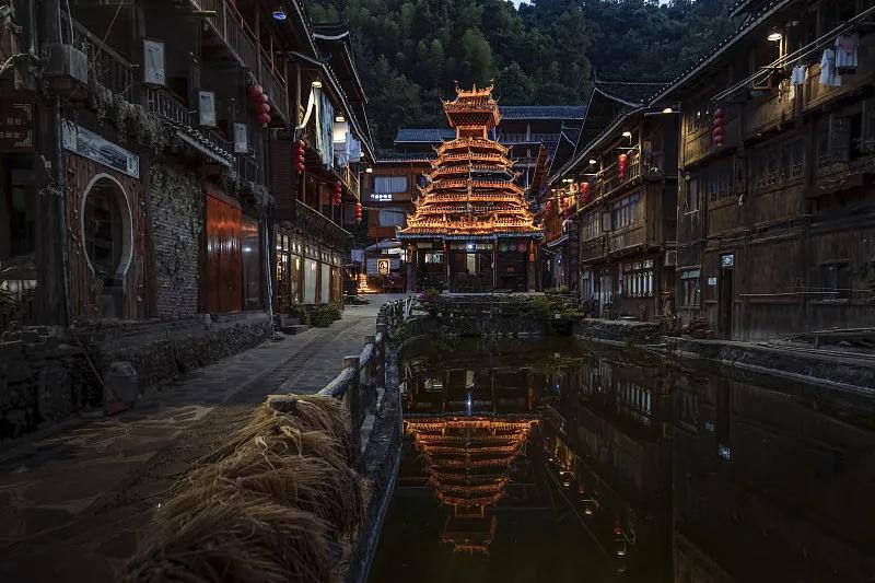 Drum tower of Zhaoxing Dong village glowing at night