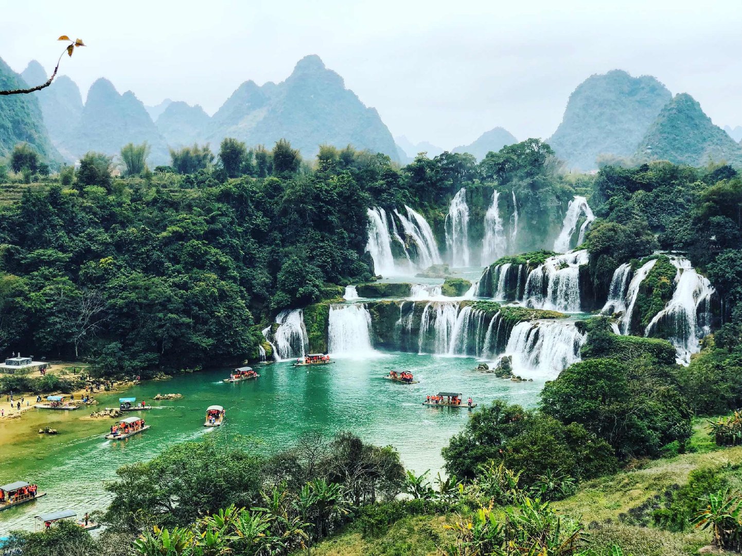 Detian waterfall and bamboo rafts on the Guichun River